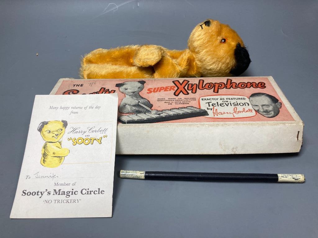 A 1950's Chad Valley Sooty hand puppet with wand, birthday card together with a boxed Sooty xylophone